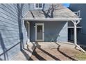 Inviting covered porch, perfect for enjoying quiet mornings or entertaining guests with comfortable seating at 10634 Park Mtn, Littleton, CO 80127