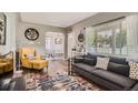 Comfortable living room with stylish furnishings, hardwood floors, and great natural light at 1309 Jamaica St, Aurora, CO 80010