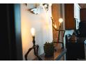 Unique lighting fixture and art decor in the hallway, with a view of the kitchen at 2261 Blake St # 5H, Denver, CO 80205