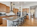 Well-appointed kitchen with a large island, stainless steel appliances, and ample cabinet space at 18926 W 94Th Ave, Arvada, CO 80007