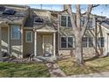 Charming townhouse displaying a well-maintained front exterior with a cozy entrance and beautiful landscaping at 1818 S Quebec Way # B15-5, Denver, CO 80231
