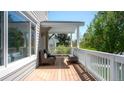 Spacious back porch with seating area, ideal for relaxing and enjoying the outdoor view at 1835 Columbine Ave, Boulder, CO 80302