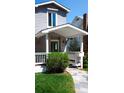 Inviting front porch with classic design elements and well-kept landscaping enhancing the home's curb appeal at 1835 Columbine Ave, Boulder, CO 80302