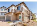 Exterior view showing the home's driveway, landscaping, and neutral color palette at 18639 E 50Th Pl, Denver, CO 80249