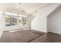 Bright living room with ample natural light and a spacious open layout at 18639 E 50Th Pl, Denver, CO 80249