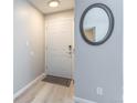 Bright condo entryway with light gray walls and wood-look floors at 5300 E Cherry Creek South Dr # 918, Denver, CO 80246