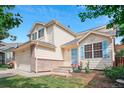 Beautiful two-story home with charming curb appeal, landscaped front yard, and unique architectural details at 3575 W Hamilton Pl, Denver, CO 80236