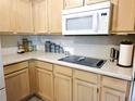 Efficient kitchen space with ample counter space, modern appliances, and light wood cabinetry at 5860 W 115Th Ave, Westminster, CO 80020