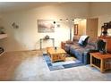 Spacious living room featuring plush carpeting, comfortable seating, and natural light at 5860 W 115Th Ave, Westminster, CO 80020