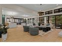 Spacious living room featuring hardwood floors, stylish furniture, and abundant natural light at 2580 Saddleback Dr, Castle Rock, CO 80104