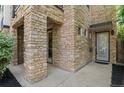 Beautiful exterior elevation featuring unique stone work, a covered entry way, and modern gray and white trim at 2745 Java Ct, Denver, CO 80211