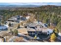 Panoramic aerial showing the house in a mountain community with views of other homes and rolling hills at 1803 Avenida Del Sol, Castle Rock, CO 80104