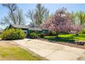 Lovely single-story home featuring a well-manicured lawn and inviting curb appeal at 1542 Kilkenny St, Boulder, CO 80303