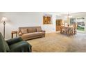 Cozy living room adjacent to dining area, featuring comfortable seating at 1542 Kilkenny St, Boulder, CO 80303