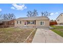 Lovely single-story home boasting a well-manicured lawn and a welcoming facade at 1530 W Berkeley Pl, Denver, CO 80221