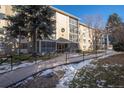 Building 200 has a welcoming entrance with winter decorations and a ramp at 3082 S Wheeling Way # 410, Aurora, CO 80014