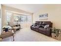 Inviting living room featuring a bay window and comfortable seating, perfect for relaxing at 11014 Callaway Rd, Parker, CO 80138