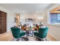 Charming living room featuring an open layout, modern furnishings, and bright, airy ambiance from natural light at 2065 Depew St, Edgewater, CO 80214