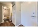 Hallway view featuring entry and bath with updated tile surround at 937 N Clarkson St # 405, Denver, CO 80218
