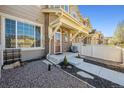 Charming townhome with a brick facade and well-maintained landscaping at 16285 W 62Nd Ln # C, Arvada, CO 80403
