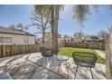 Backyard patio area perfect for outdoor relaxation with fenced-in yard at 2448 S Galapago St, Denver, CO 80223