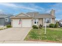 Charming home with two-car garage, neat landscaping, and welcoming entrance offers suburban living at 4369 E 127Th Way, Thornton, CO 80241