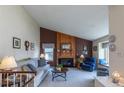 Inviting living room with a cozy fireplace, neutral colors, and comfortable seating at 4369 E 127Th Way, Thornton, CO 80241