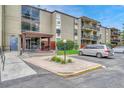 Building exterior showing entrance and parking at 2231 S Vaughn Way # 305B, Aurora, CO 80014