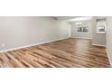 Bright living room features hardwood floors, a window for natural light, and fresh neutral paint at 1179 Salem St, Aurora, CO 80011
