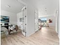 Bright home office with french doors, light wood floors and ample natural light at 4666 S Malaya Ct, Aurora, CO 80015