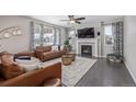 Comfortable living room with a cozy fireplace, hardwood floors, and stylish decor at 12510 Fisher St, Englewood, CO 80112