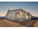 Picture of the rear of a home featuring a covered patio with recessed lighting, perfect for outdoor living at 9688 Winterset Cir, Littleton, CO 80125