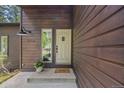 Close-up of the home's entrance showcasing the front door and well-kept exterior at 30866 Kings Valley Way, Conifer, CO 80433