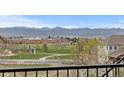 Scenic mountain views overlooking the neighborhood park and recreational areas at 10597 Soulmark Way, Highlands Ranch, CO 80126