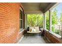 Inviting front porch with a comfortable bench and decorative pillows at 2845 Quitman St, Denver, CO 80212