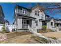 Charming two-story home with Hardie board siding, welcoming front porch, and professional landscaping at 2455 Alpine St, Longmont, CO 80504