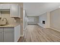 Modern kitchen featuring granite countertops and white cabinets at 4110 Hale Pkwy # 1E, Denver, CO 80220
