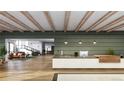 Modern building lobby with stylish reception desk and comfortable seating area at 12983 W Ida Ave # 400, Littleton, CO 80127