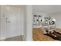 Inviting entryway with a secure front door and warm wood flooring leading to a bright, modern living space at 4800 E Hale Pkwy # 802N, Denver, CO 80220