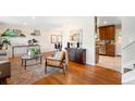Comfortable living room with hardwood floors flowing into an open layout at 9325 Meade St, Westminster, CO 80031