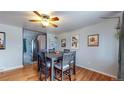 Dining area with hardwood floors and table for four at 1242 Elder St, Denver, CO 80221