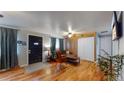 Living room with hardwood floors, comfy seating at 1242 Elder St, Denver, CO 80221
