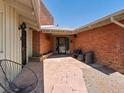Inviting front porch features seating and stone tiling at 10400 W 35Th Pl, Wheat Ridge, CO 80033