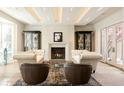 Elegant living room with fireplace and ample natural light at 335 Clayton St, Denver, CO 80206