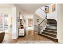 Grand staircase with wrought iron railing and hardwood treads at 335 Clayton St, Denver, CO 80206