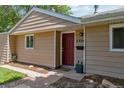 Inviting entrance with a red front door, well-manicured landscaping, and clear house number at 3278 S Forest St, Denver, CO 80222