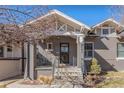 Traditional home with a brick facade, inviting front porch, and classic architectural details with front yard at 543 N Marion St, Denver, CO 80218