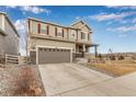 Beautifully designed two-story home featuring a two-car garage, covered porch, and an inviting curb appeal at 3659 Makley Cir, Castle Rock, CO 80104