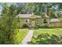 Quaint home with stone accents and a well-maintained lawn at 1975 Cody St, Lakewood, CO 80215