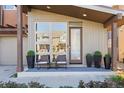 Welcoming front entrance with modern design, attractive landscaping, and cozy seating area at 3734 Ridgeway St, Boulder, CO 80301